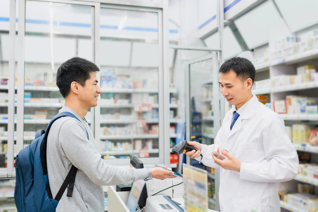 pharmacist doing tap to pay