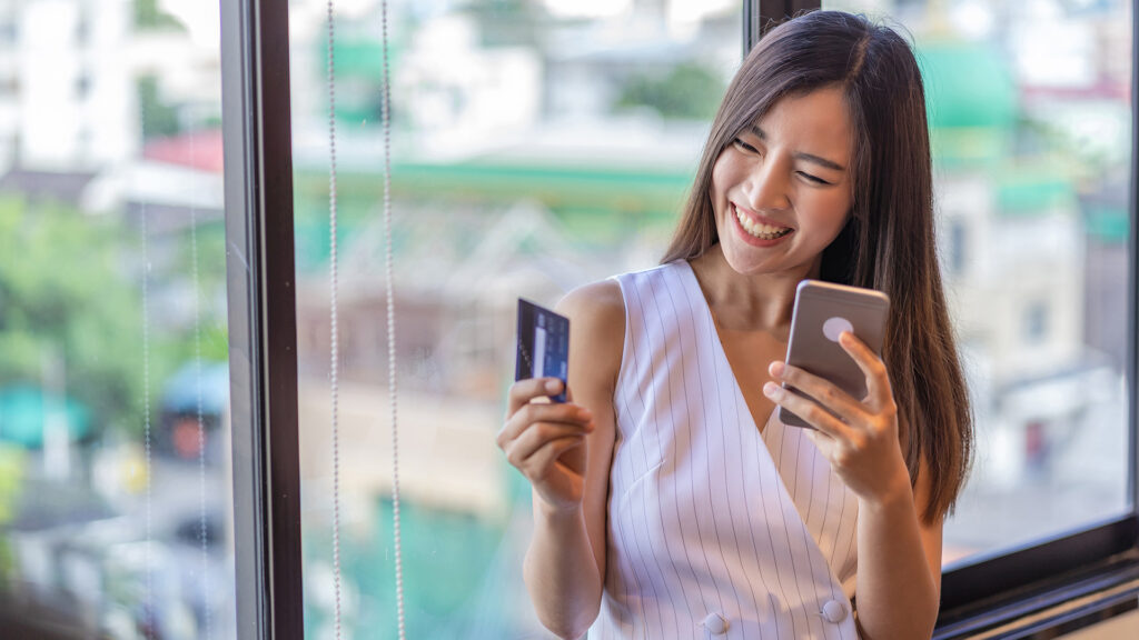 Asian business woman shopping on mobile phone