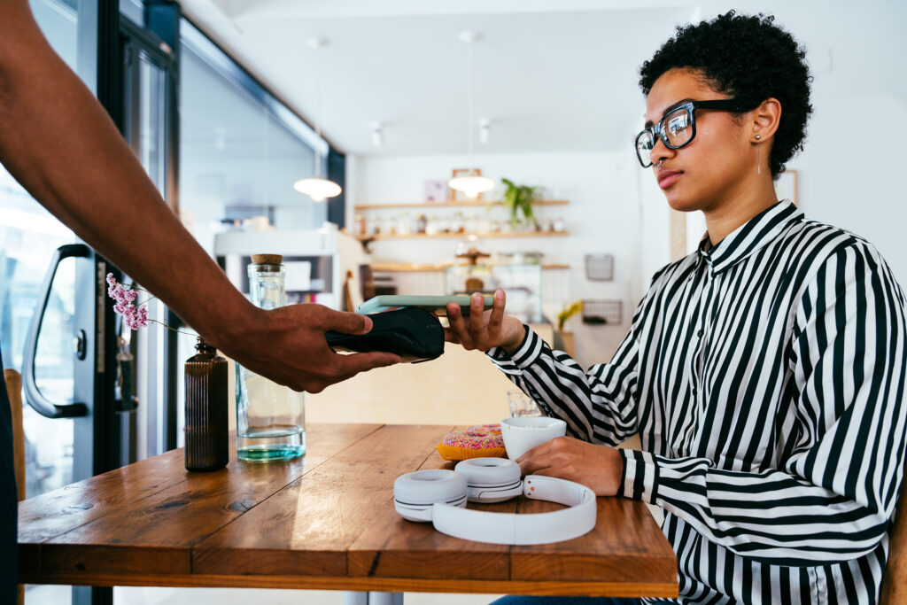 Barista working in a bar cafeteria