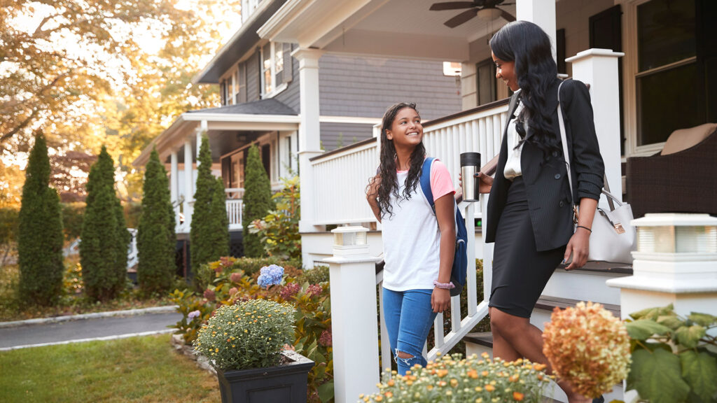 Mother and daughter leaving home in the morning for school and work