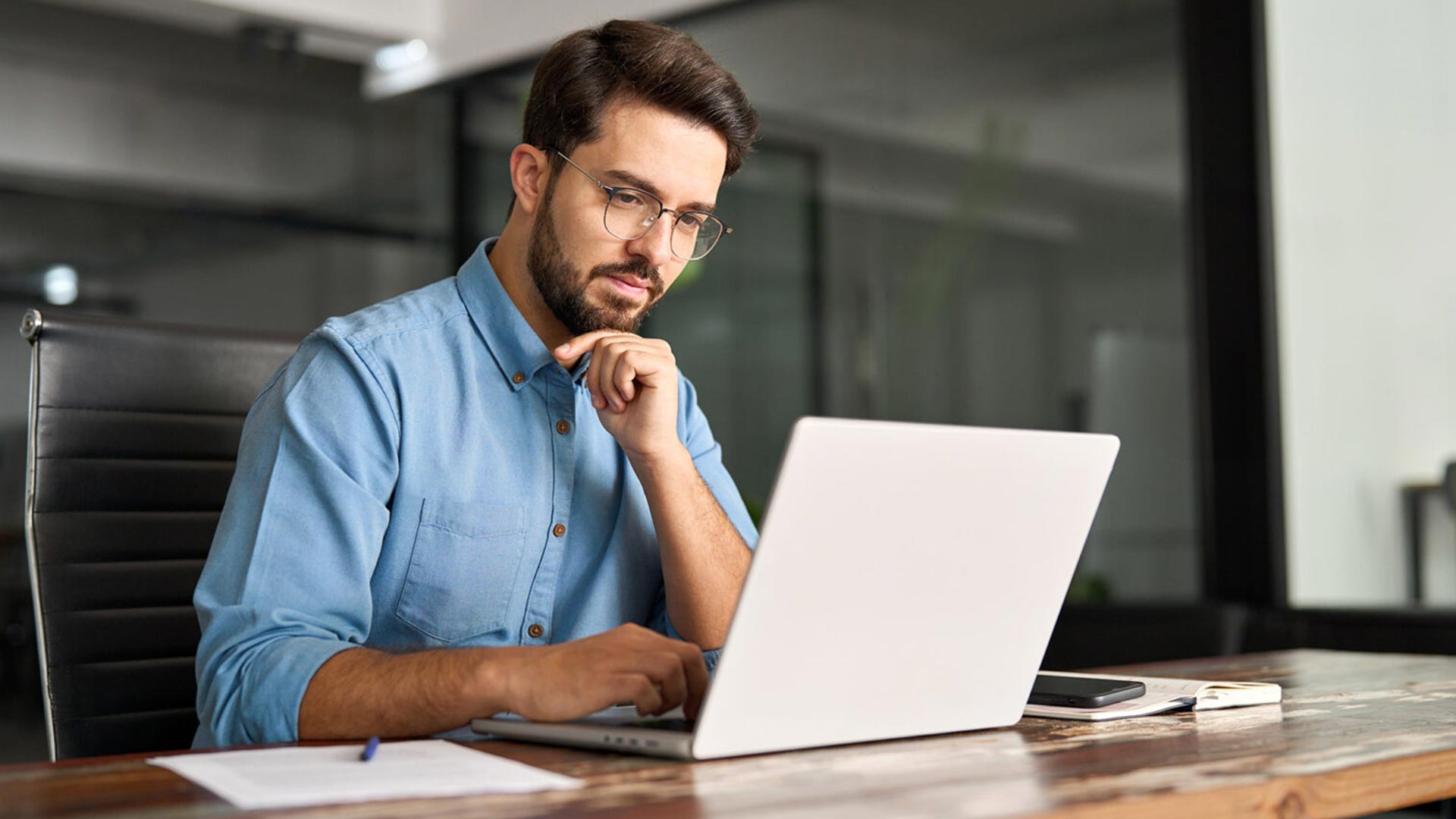 Casual business man working at laptop