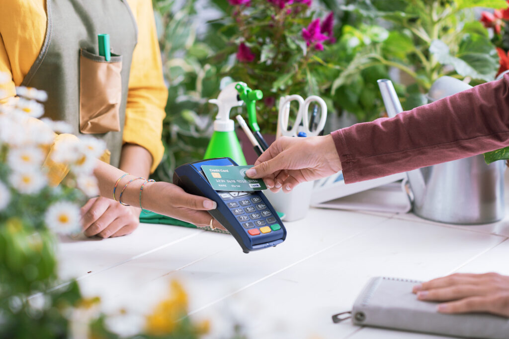 Customer paying at a flower shop