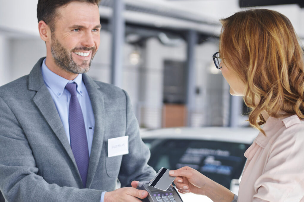 Female customer paying for new purchase