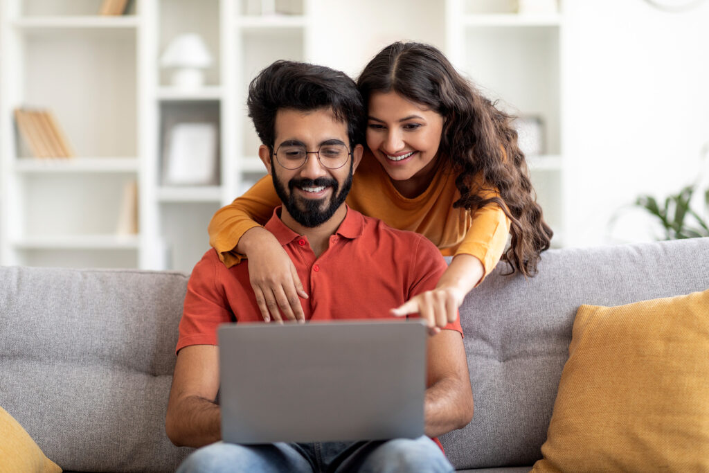 Young Indian couple shops together online