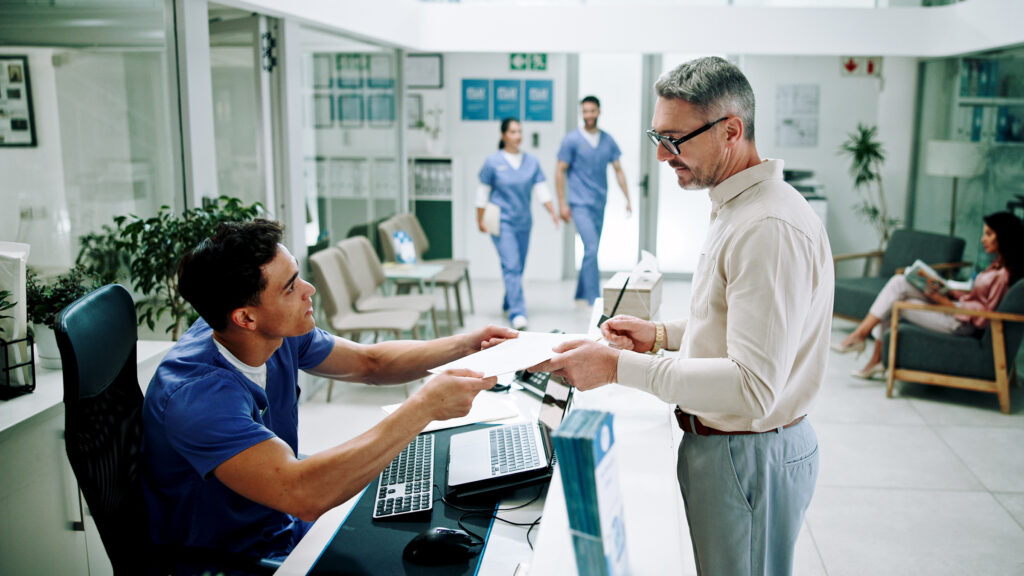 Hospital, nurse and man at front desk with paperwork for appointment, consultation and medical serv