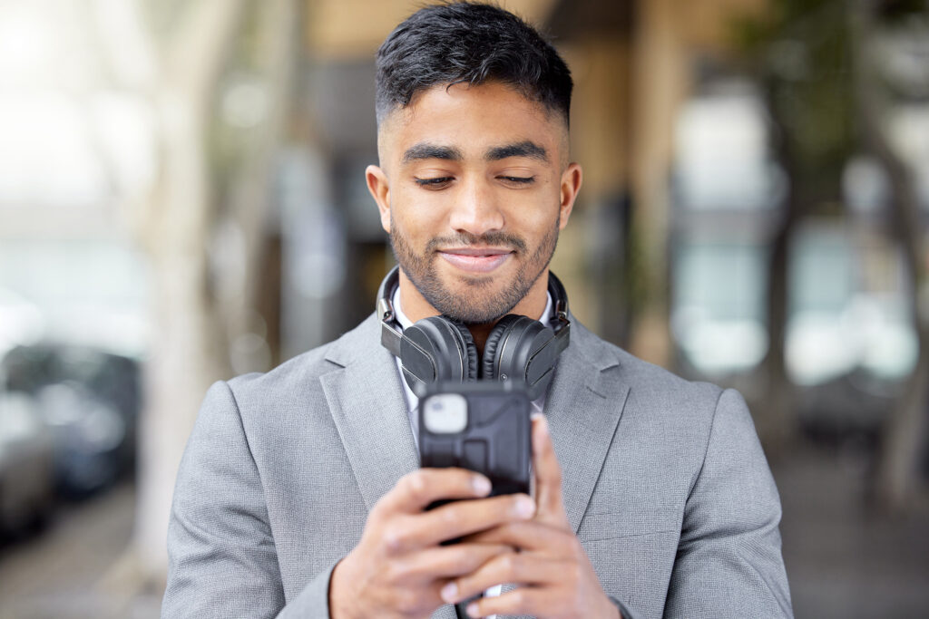 man texting and smiling