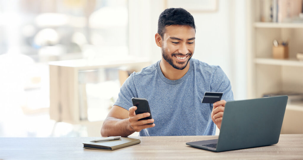 Young man paying bills