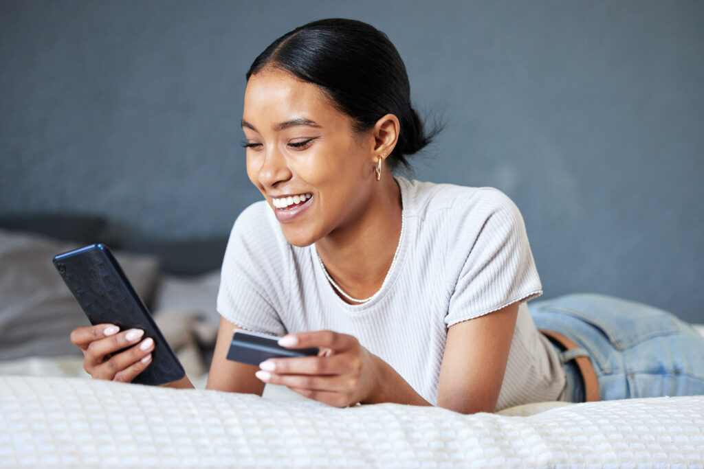 Young woman doing online mobile shopping